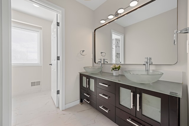 1525 Hiller Rd, West Bloomfield, MI 48324 - bathroom with a sink, marble finish floor, double vanity, and visible vents