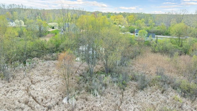 1525 Hiller Rd, West Bloomfield, MI 48324 - drone / aerial view featuring a wooded view
