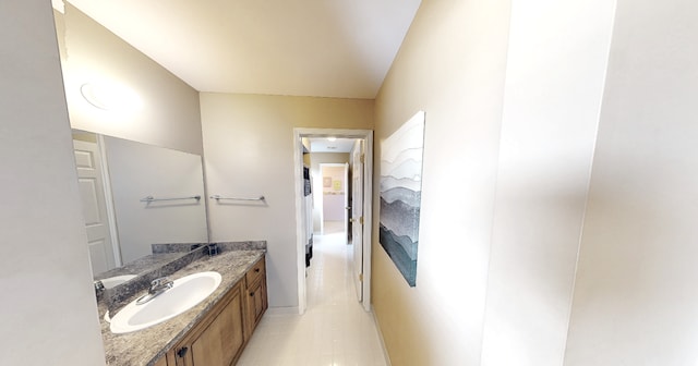 bathroom featuring tile patterned flooring and vanity