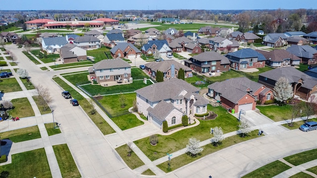 birds eye view of property with a residential view