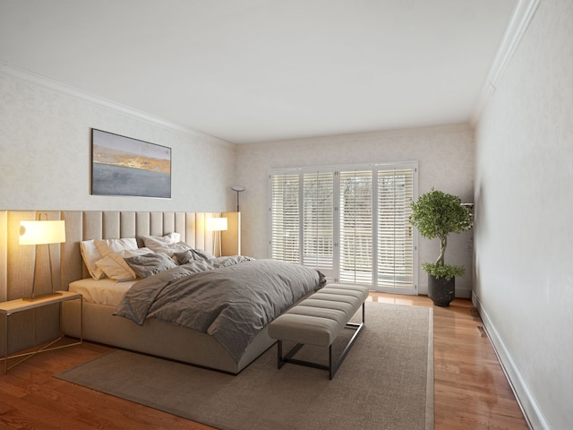 bedroom with baseboards, ornamental molding, wood finished floors, and access to exterior