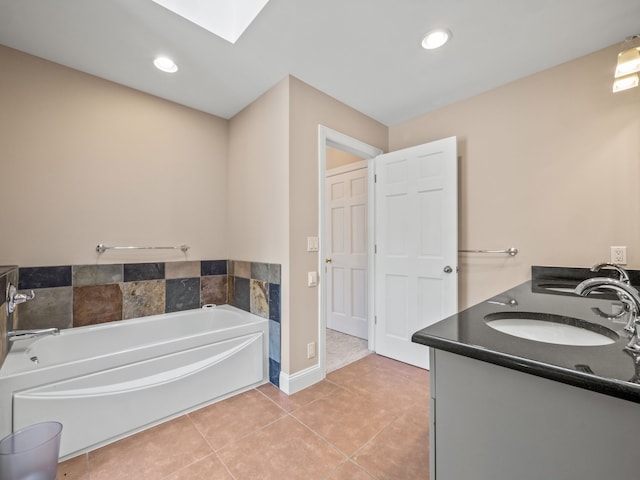 full bathroom with a bath, tile patterned floors, a sink, and double vanity