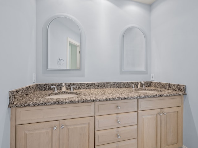 bathroom with double vanity and a sink