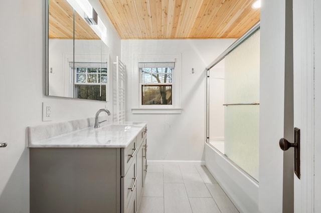 bathroom with shower / bath combination with glass door, tile patterned floors, vanity, baseboards, and wood ceiling