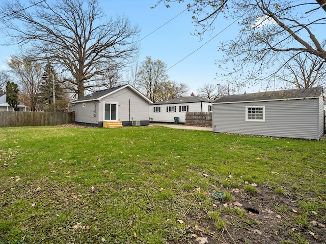 rear view of property featuring entry steps
