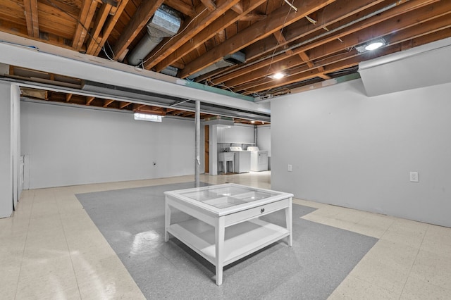 finished below grade area featuring independent washer and dryer
