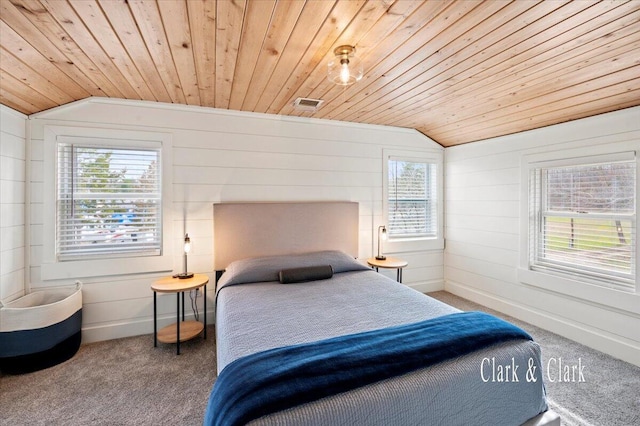 carpeted bedroom with lofted ceiling, wooden ceiling, and multiple windows