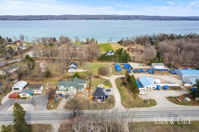 birds eye view of property featuring a residential view and a water view