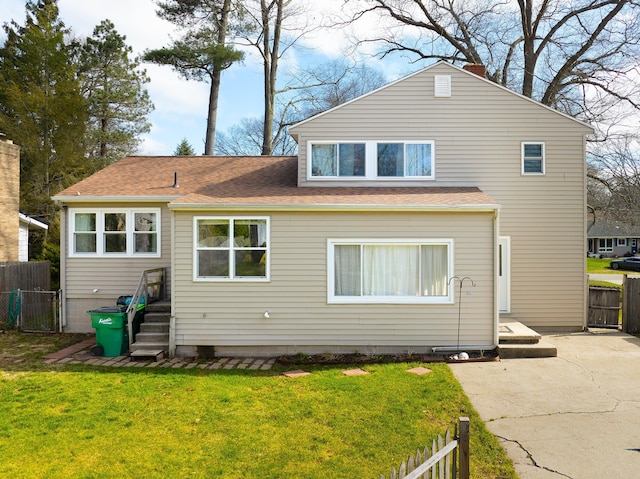 135 California Ave, Muskegon, MI 49445 - back of property with fence and a yard