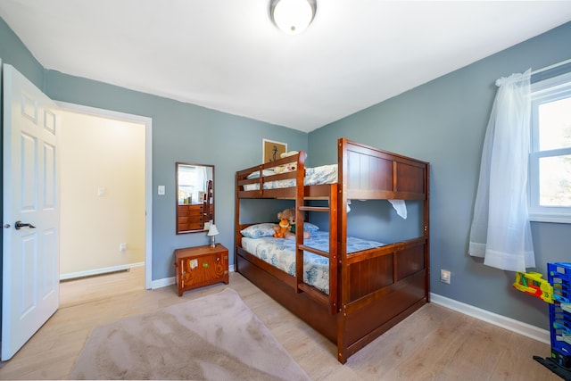 135 California Ave, Muskegon, MI 49445 - bedroom with wood finished floors and baseboards