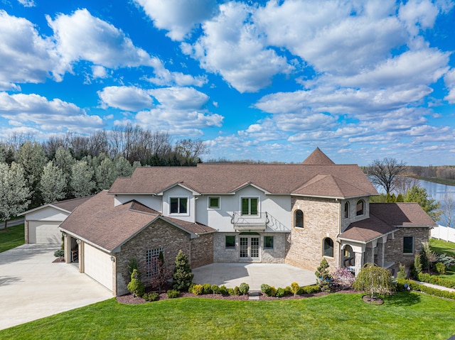 7455 Groveland Rd, Holly, MI 48442 - view of front of property with stone siding, a front lawn, french doors, and stucco siding