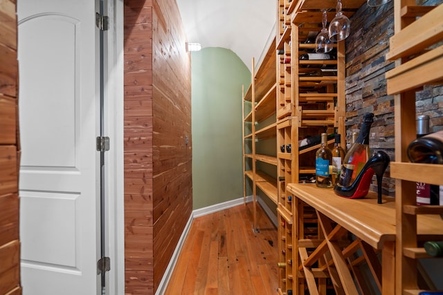 7455 Groveland Rd, Holly, MI 48442 - wine room featuring wood walls and hardwood / wood-style flooring