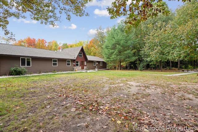 2697 N 176th Ave, Walkerville, MI 49459 - view of home's exterior with a chimney and a yard