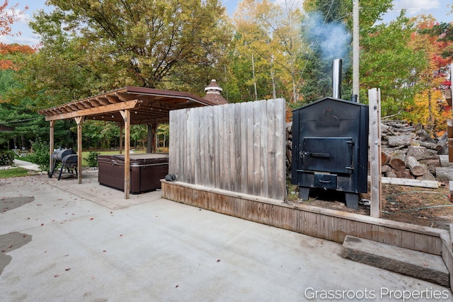 2697 N 176th Ave, Walkerville, MI 49459 - view of patio / terrace featuring a hot tub and a pergola