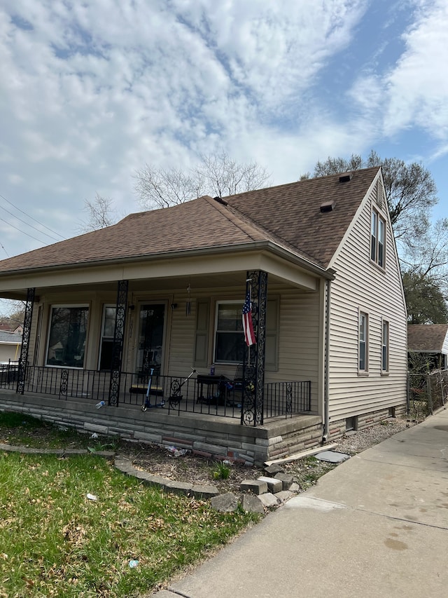 2011 Goddard Rd, Lincoln Park, MI 48146 - bungalow-style house with a shingled roof and covered porch