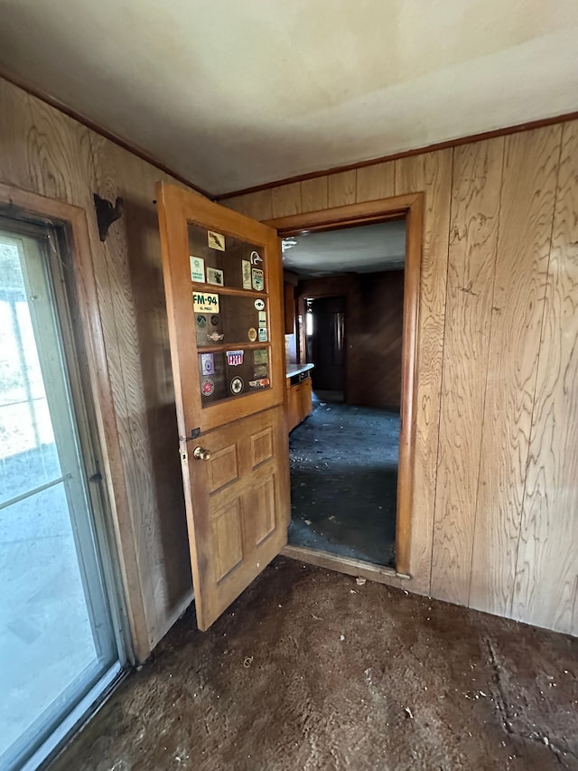 interior space featuring wood walls