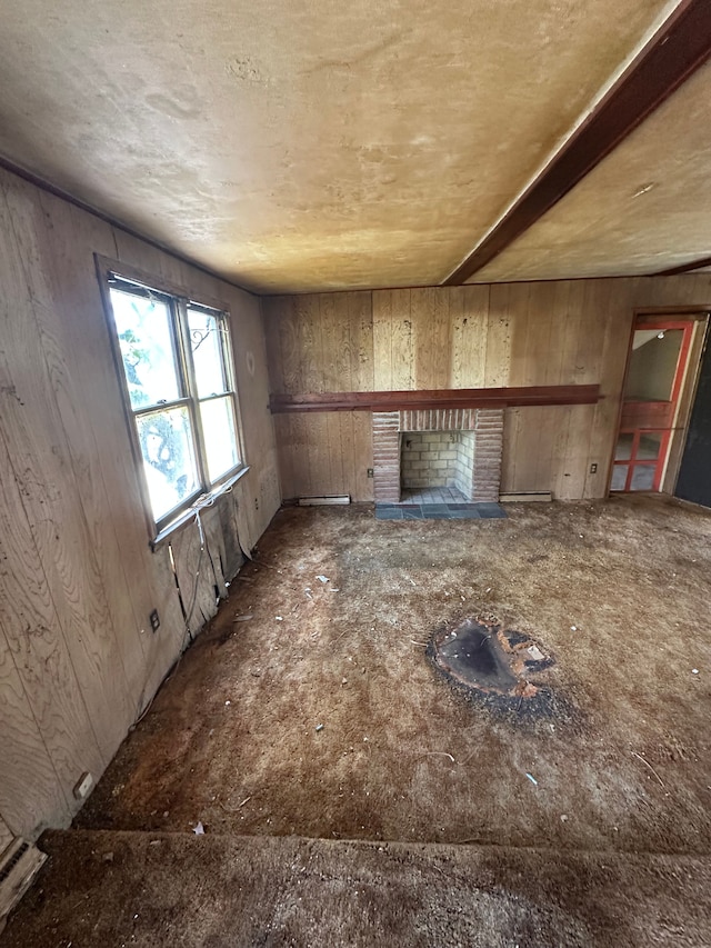 interior space featuring a brick fireplace and wooden walls