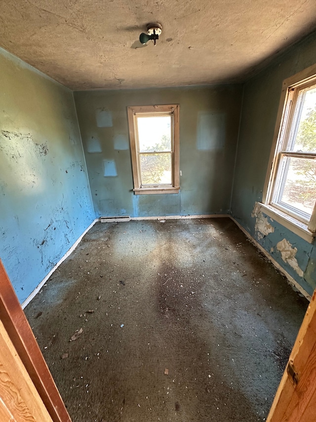 empty room featuring baseboard heating