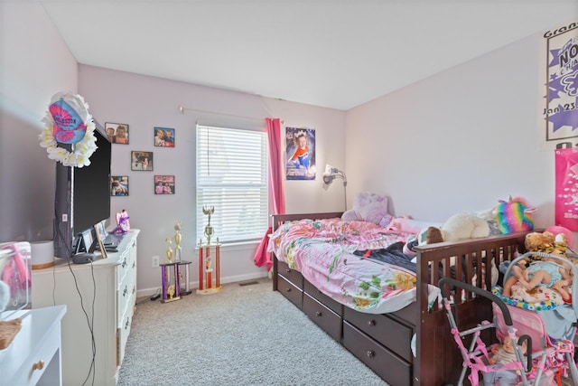 bedroom featuring baseboards and carpet flooring