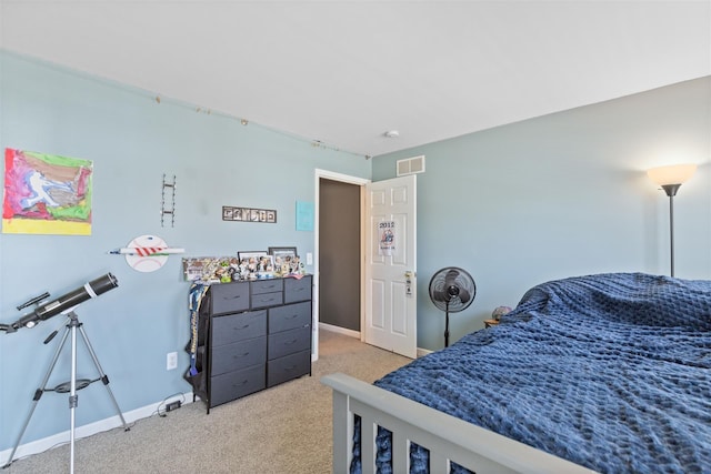 carpeted bedroom with visible vents and baseboards