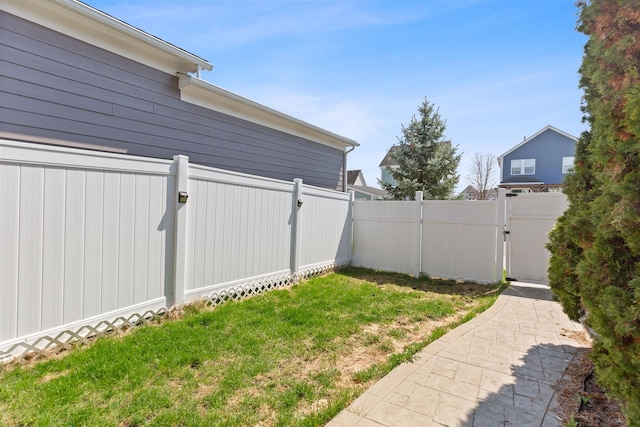 view of yard with a gate and fence