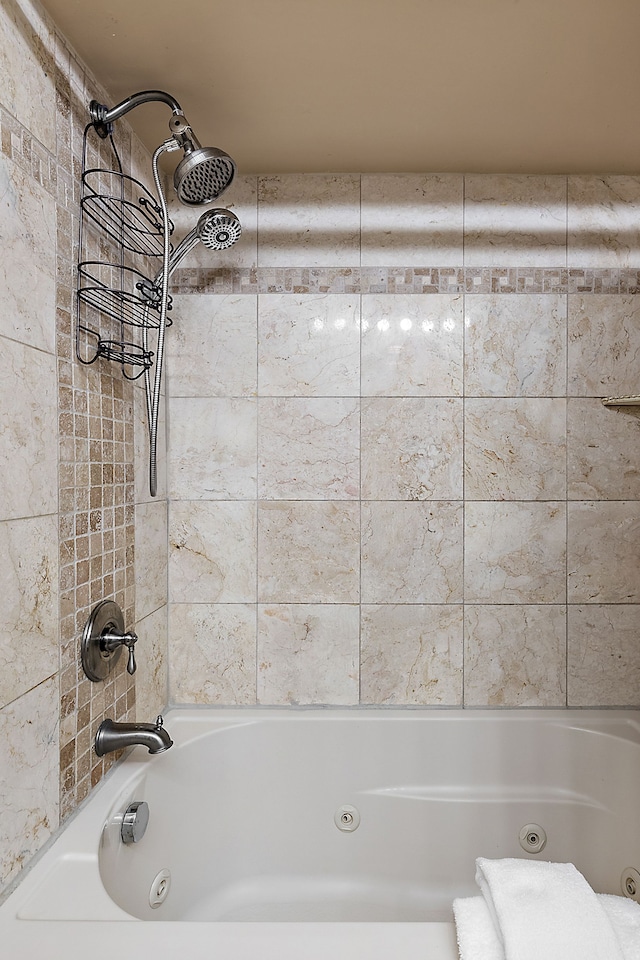 full bath with a combined bath / shower with jetted tub