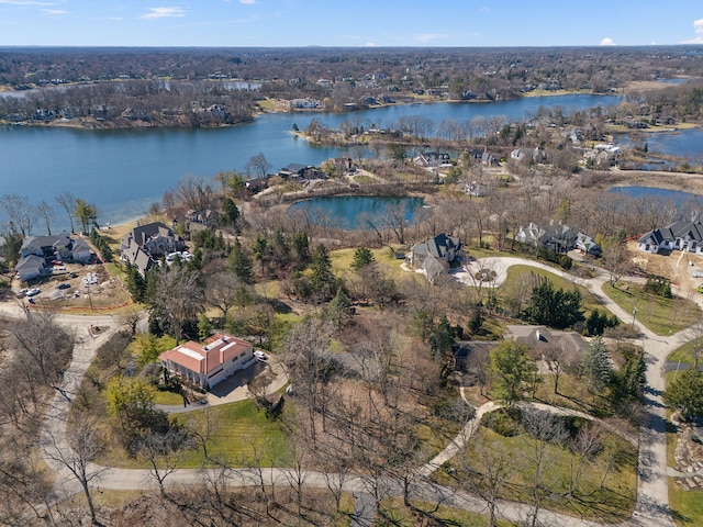 bird's eye view featuring a water view and a residential view