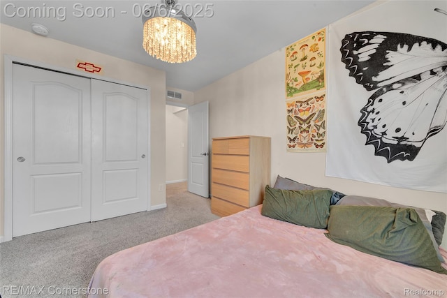 51306 Kirby Dr, Chesterfield, MI 48047 - carpeted bedroom with a chandelier, a closet, and baseboards