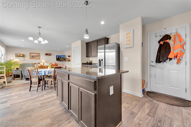 51306 Kirby Dr, Chesterfield, MI 48047 - kitchen with stainless steel fridge with ice dispenser, a chandelier, light wood-type flooring, a kitchen island, and dark brown cabinets