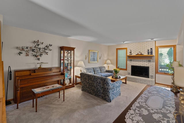 living area with carpet floors, baseboards, and a fireplace