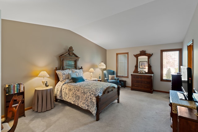 bedroom featuring carpet floors, baseboards, and lofted ceiling