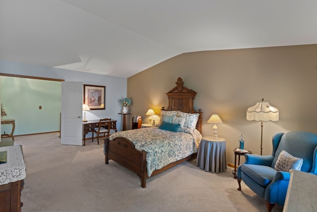 bedroom featuring carpet flooring, baseboards, and vaulted ceiling