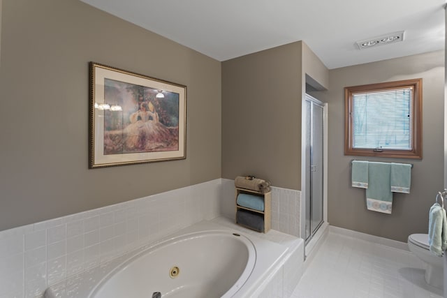 bathroom featuring a shower stall, tile patterned floors, baseboards, a whirlpool tub, and toilet