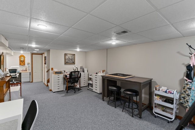 carpeted office with visible vents and a drop ceiling