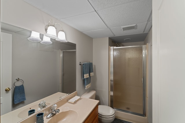 full bath with visible vents, a paneled ceiling, and a shower stall