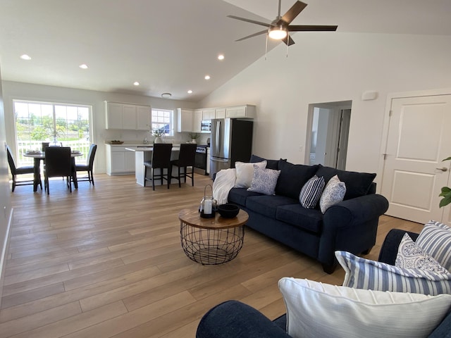 9150 Cottage Xing Unit 23, Richland, MI 49083 - living area featuring high vaulted ceiling, ceiling fan, light wood-type flooring, and recessed lighting