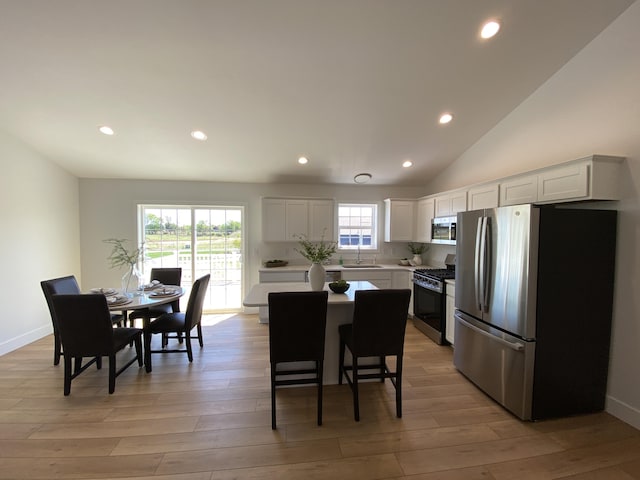 9150 Cottage Xing Unit 23, Richland, MI 49083 - kitchen with appliances with stainless steel finishes, a sink, light countertops, white cabinets, and recessed lighting