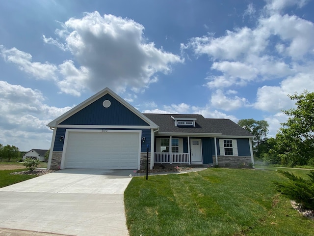 9150 Cottage Xing Unit 23, Richland, MI 49083 - view of front of home featuring a front yard, a porch, stone siding, and driveway