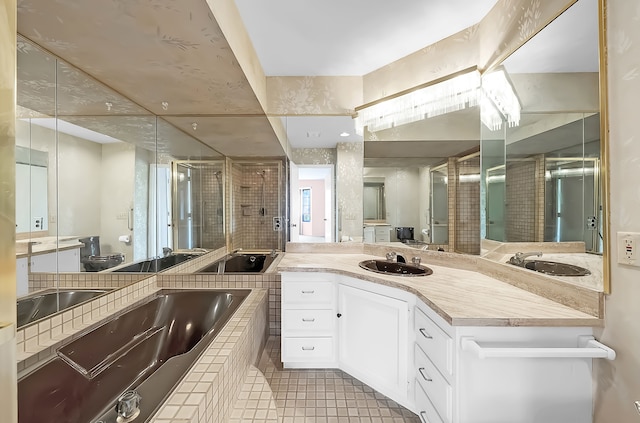full bath with a bath, vanity, tile patterned flooring, and a stall shower