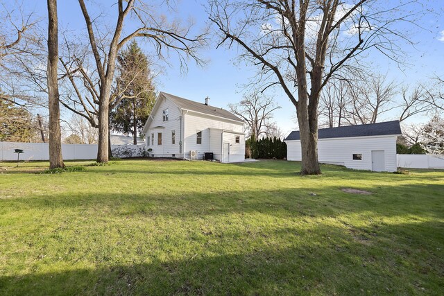516 W Detroit St, New Buffalo, MI 49117 - view of yard with fence and an outbuilding