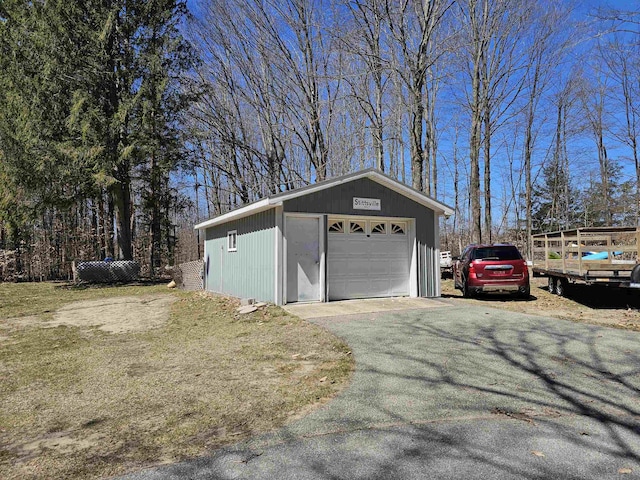 detached garage with aphalt driveway