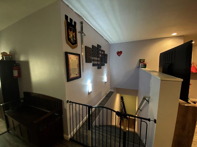 835 Eden St, Kingsley, MI 49649 - staircase featuring baseboards and recessed lighting