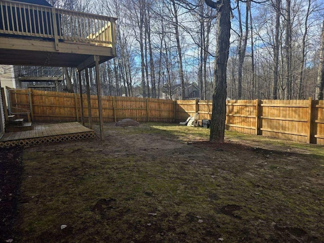 835 Eden St, Kingsley, MI 49649 - view of yard with a fenced backyard and a deck