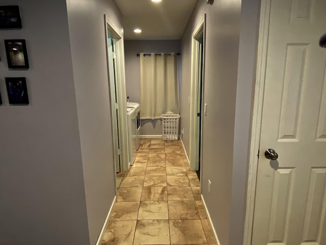 835 Eden St, Kingsley, MI 49649 - hall with washing machine and dryer, baseboards, and recessed lighting