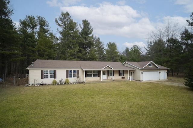 9155 Ivanhoe Dr, Onekama, MI 49675 - single story home featuring an attached garage, a porch, a front yard, and driveway