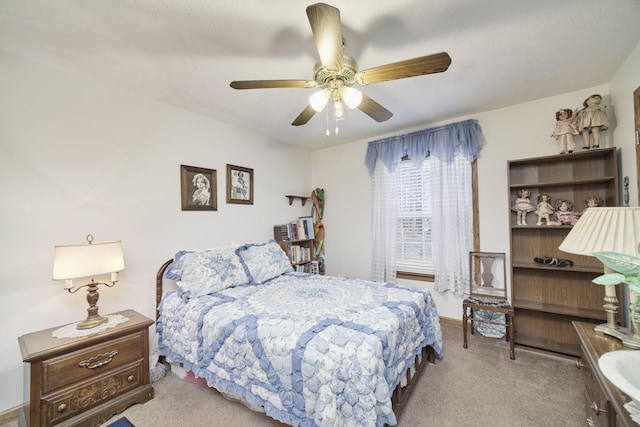 9155 Ivanhoe Dr, Onekama, MI 49675 - carpeted bedroom featuring a ceiling fan