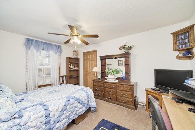 9155 Ivanhoe Dr, Onekama, MI 49675 - bedroom with carpet flooring and a ceiling fan