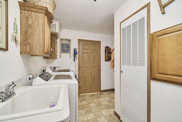 9155 Ivanhoe Dr, Onekama, MI 49675 - clothes washing area featuring cabinet space, washer and dryer, a heating unit, and a sink