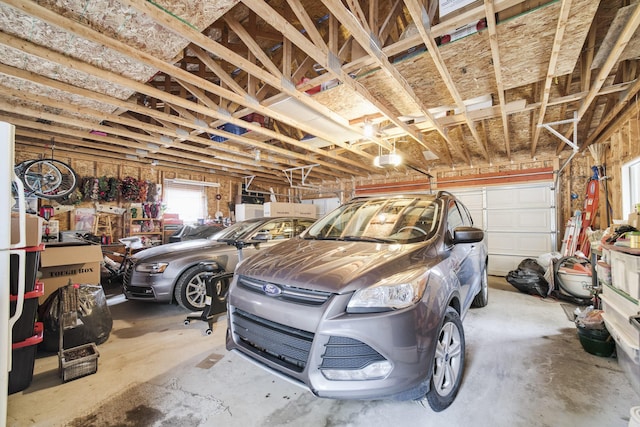 9155 Ivanhoe Dr, Onekama, MI 49675 - garage with a garage door opener