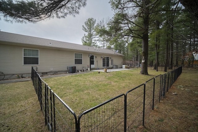 9155 Ivanhoe Dr, Onekama, MI 49675 - view of yard featuring central AC unit, a patio area, and fence private yard